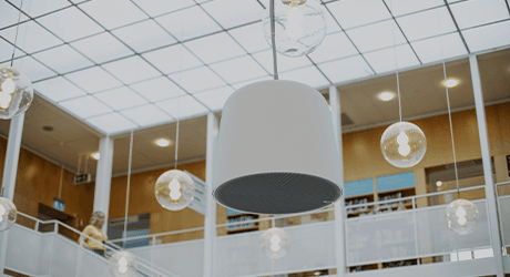 big speaker hanging from the ceiling