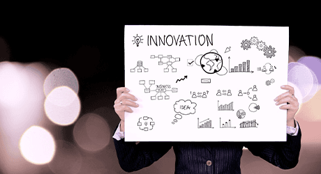 person holding a innovation poster