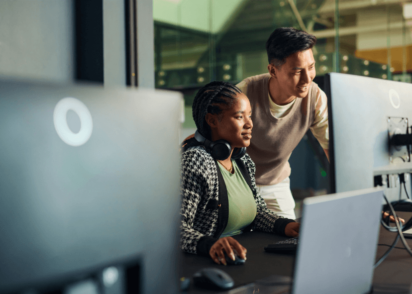 man and woman working on computer