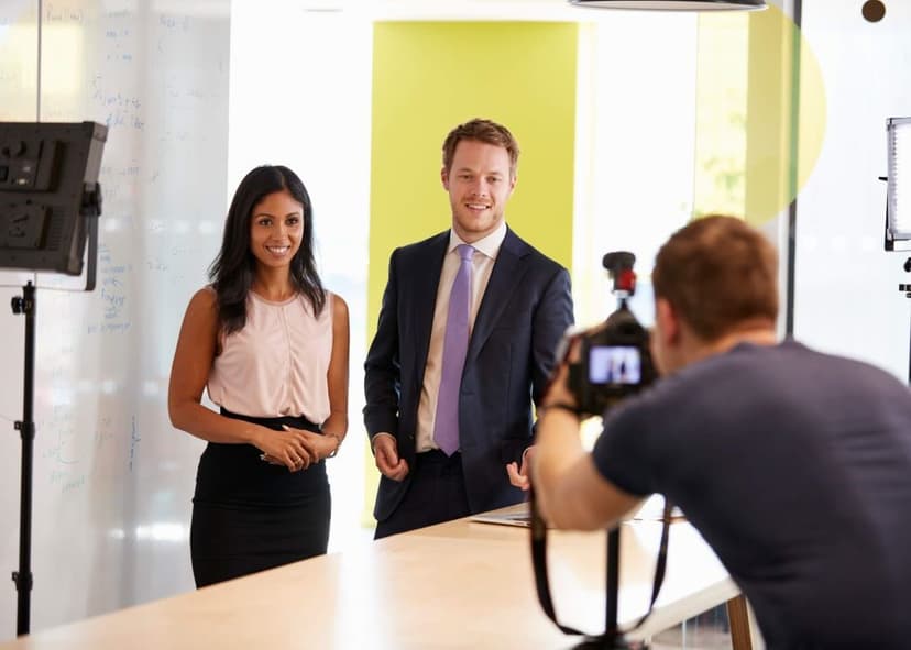 People being recorded by corporate videographer